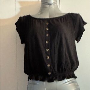 Black Top. Buttons on front.